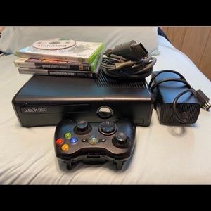 Xbox 360 with cables, games, and controller